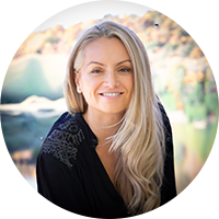 Blonde business woman wearing a black blouse