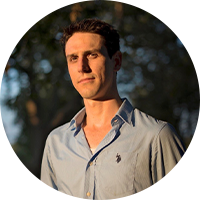 Photo of a business man wearing a button up polo shirt