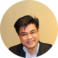 Headshot of a young asian professional in black suit